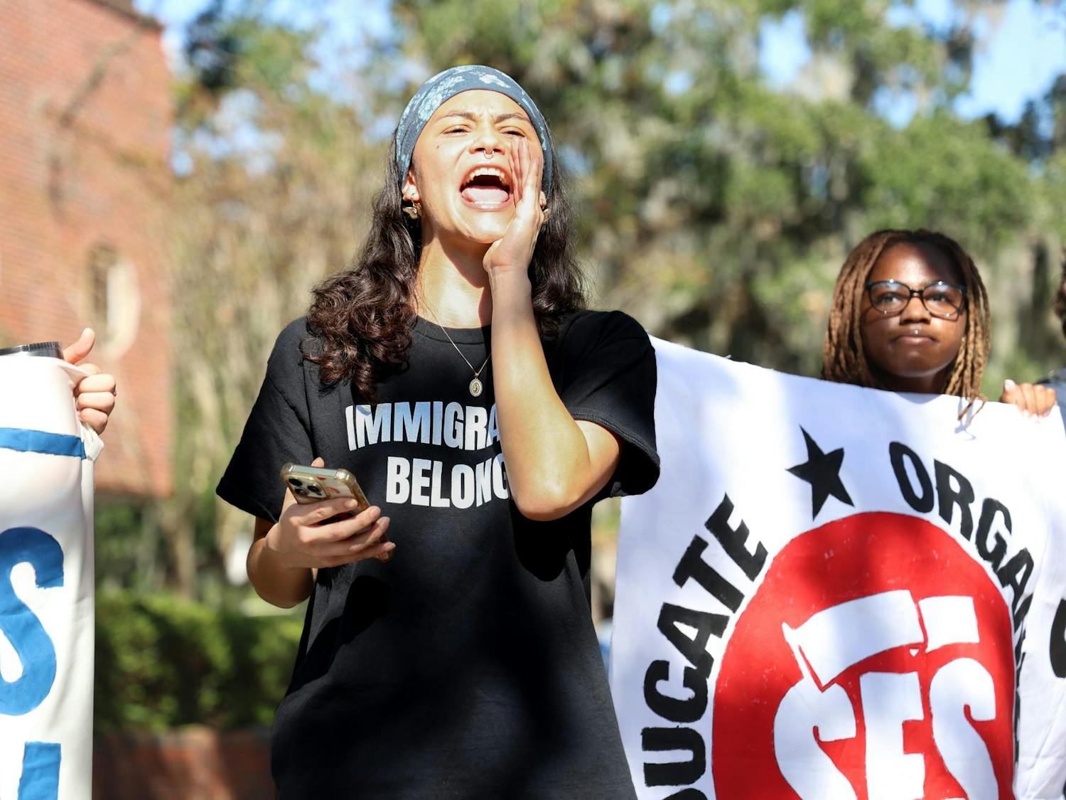 Dani Gonzalez leads chants at a Students for Socialism at the Unviersity of Floirda walkout to demand UFPD end its 287(g) agreement with ICE at Turlingotn Plaza, Thursday, Nov. 20, 2025.