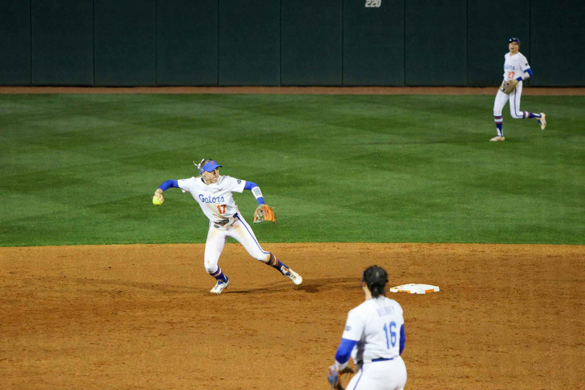 Florida infielder Skylar Wallace prepares to throw to first base in the Gators' 3-0 win against the Central Florida Knights Wednesday, March 8, 2023 