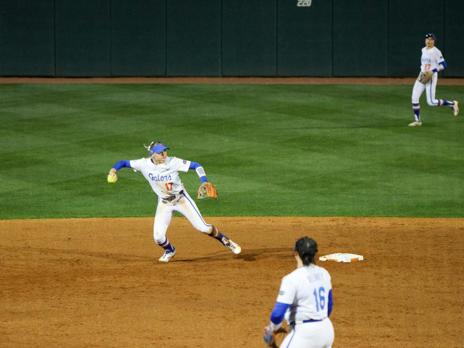 Florida infielder Skylar Wallace prepares to throw to first base in the Gators' 3-0 win against the Central Florida Knights Wednesday, March 8, 2023