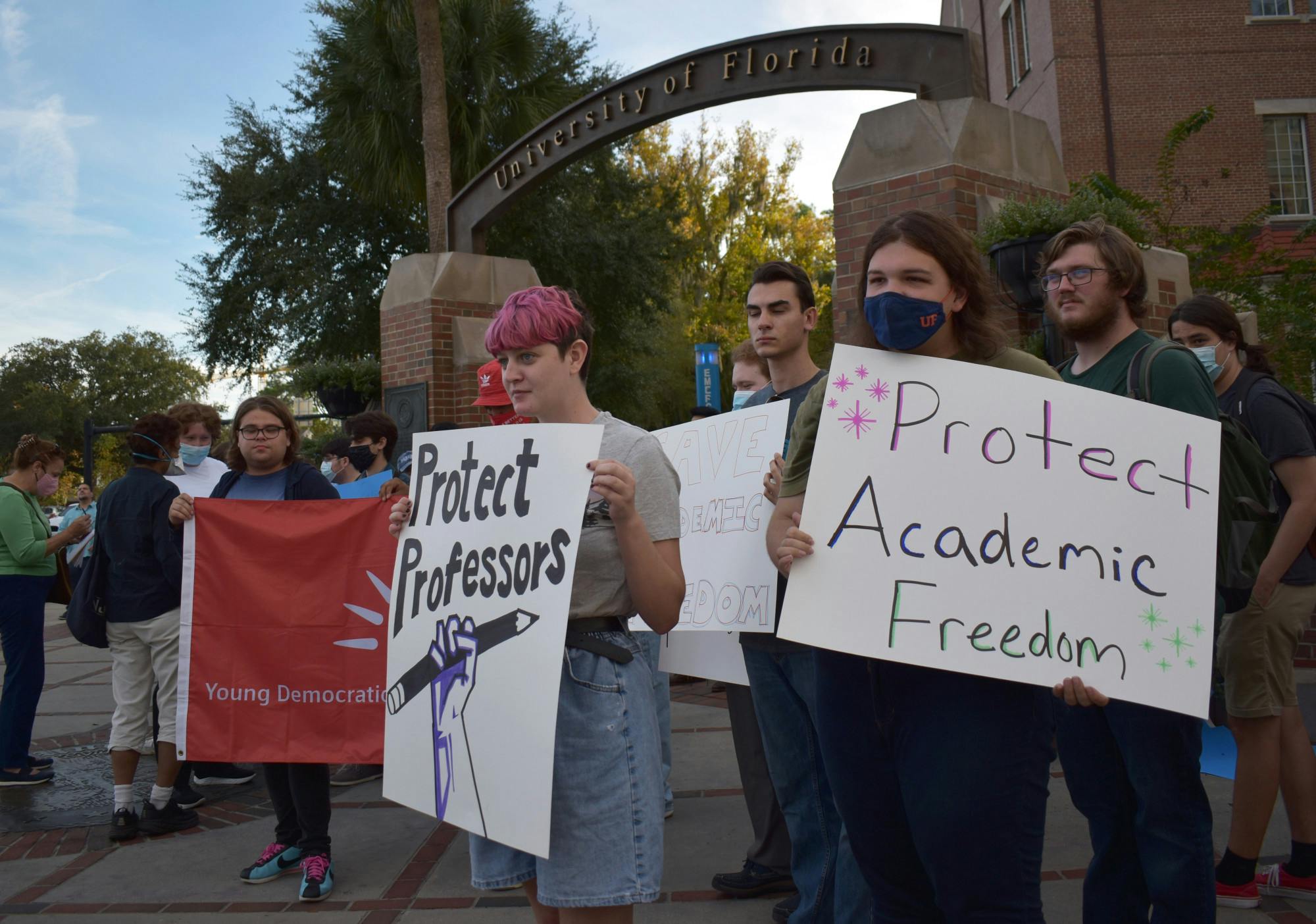 Students protest against UF for initially denying three professors the ability to testify in a case against the state on Friday, Nov. 12, 2021 on the corner of West University Avenue and Northwest 13th Street.