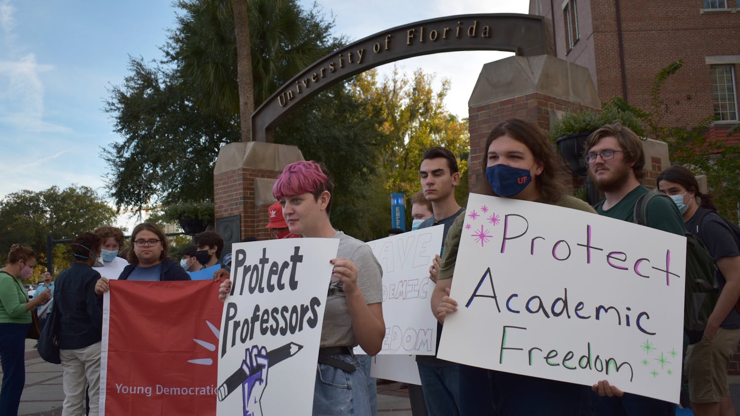 Students protest against UF for initially denying three professors the ability to testify in a case against the state on Friday, Nov. 12, 2021 on the corner of West University Avenue and Northwest 13th Street.