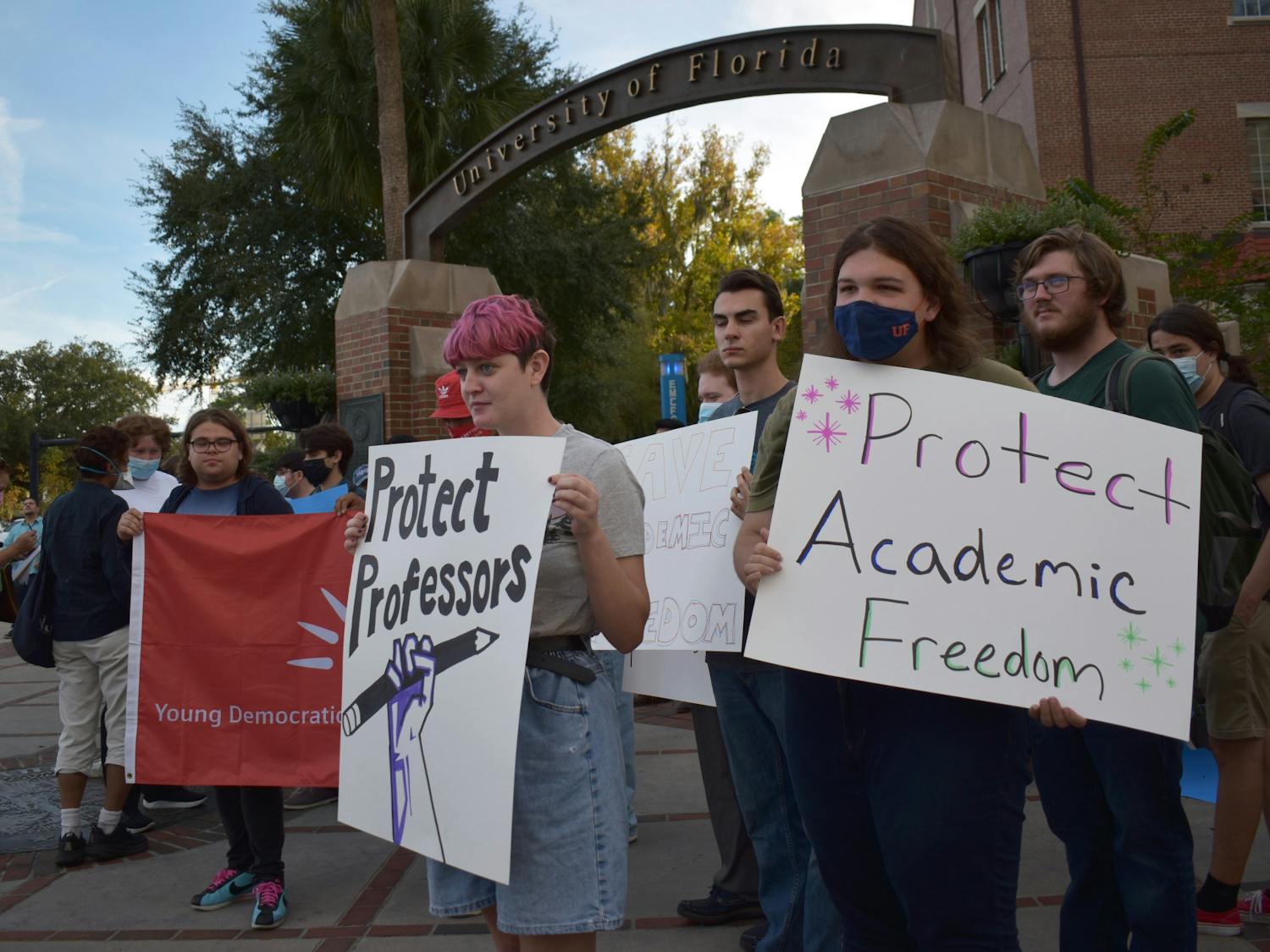 Students protest against UF for initially denying three professors the ability to testify in a case against the state on Friday, Nov. 12, 2021 on the corner of West University Avenue and Northwest 13th Street.