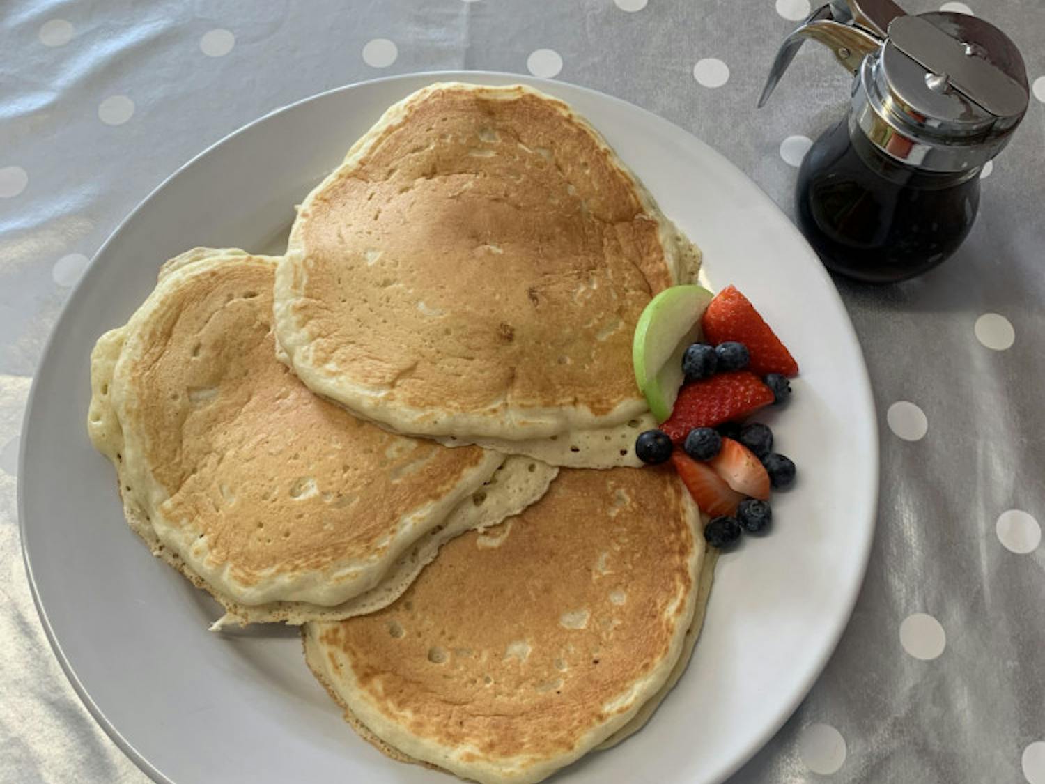 Hidden gem Daybreak Pleasant Street provides melt-in-your mouth pancakes with a side of fruit.