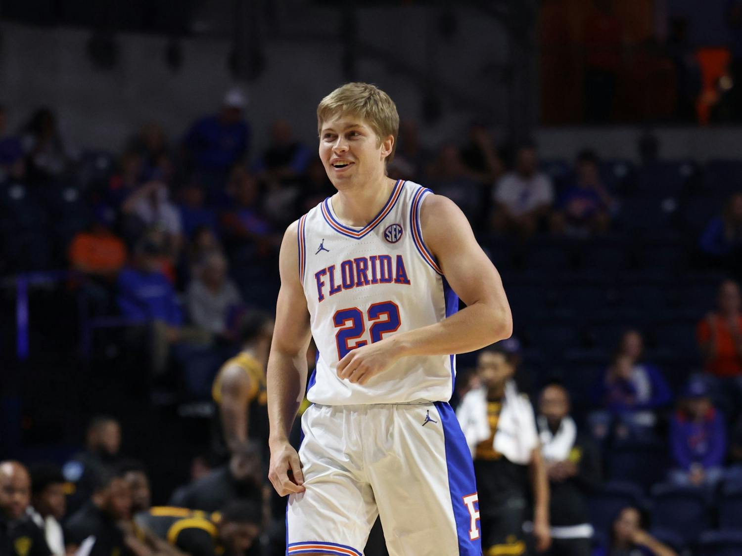 Senior guard Bennett Andersen smiles on the court in the Gators’ 96-57 win against the Grambling State Tigers on Dec. 22, 2023.