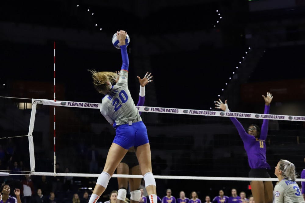 Florida's Thayer Hall spikes a ball against LSU in 2019. Hall and the Gators won their season-opening match against San Francisco Friday night in part of the Hornet Invitational.