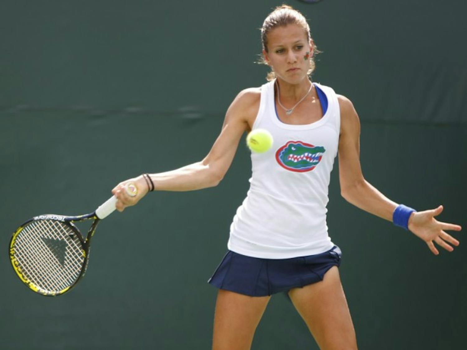 Olivia Janowicz prepares to return a serve in a match against Duke in 2011.
