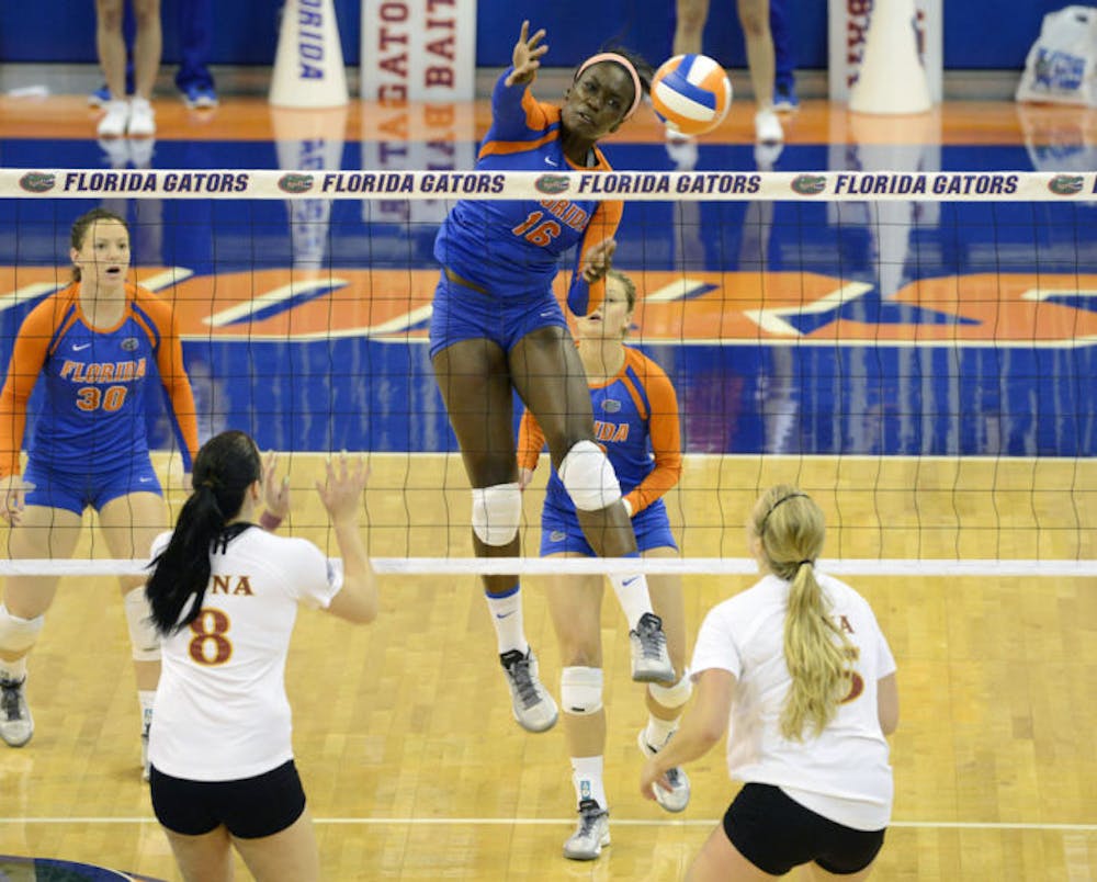 <p>Sophomore middle blocker Simone Antwi (16) jumps to block the ball during Florida’s three-set win against Iona on Sept. 14 in the O’Connell Center.</p>
