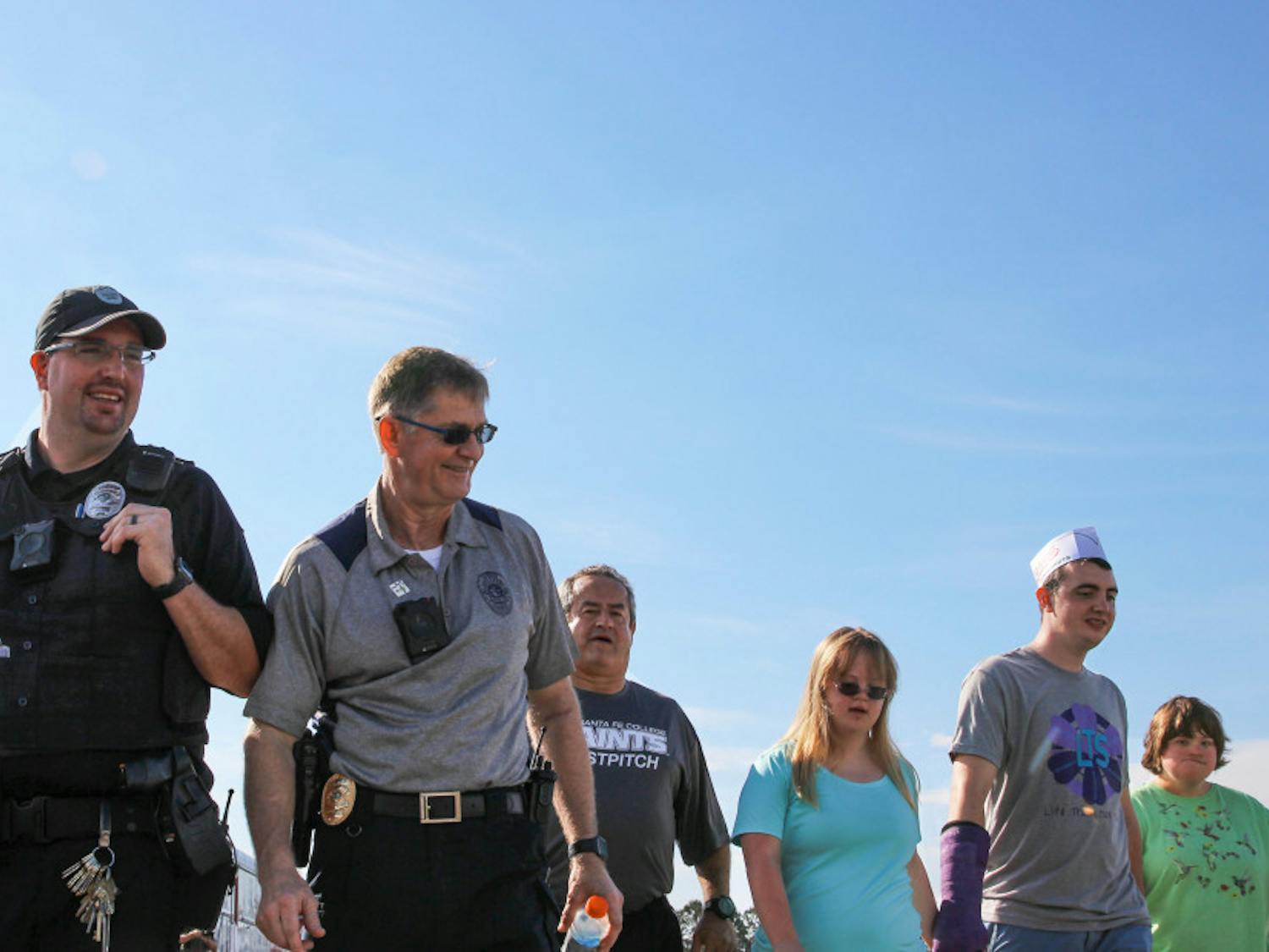 Santa Fe Police Chief Ed Book participates in the Fourth Annual "Run With The Cops" walk at the Santa Fe track. He is joined by fellow officers, Gainesville locals, students, organizations, and many more. 
