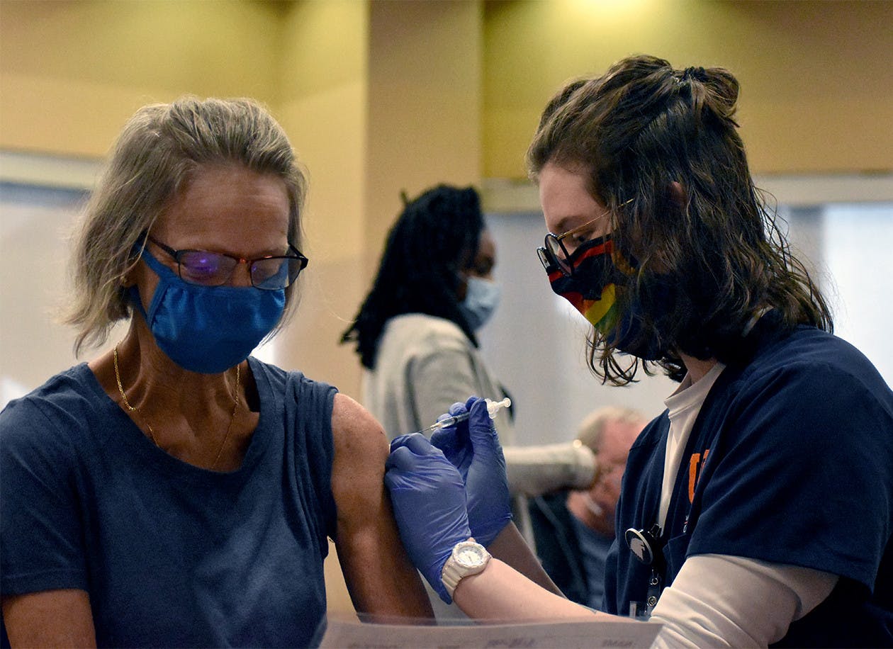 A UF Health nurse prepares to administer a COVID-19 vaccine Friday, Feb.5, 2021.