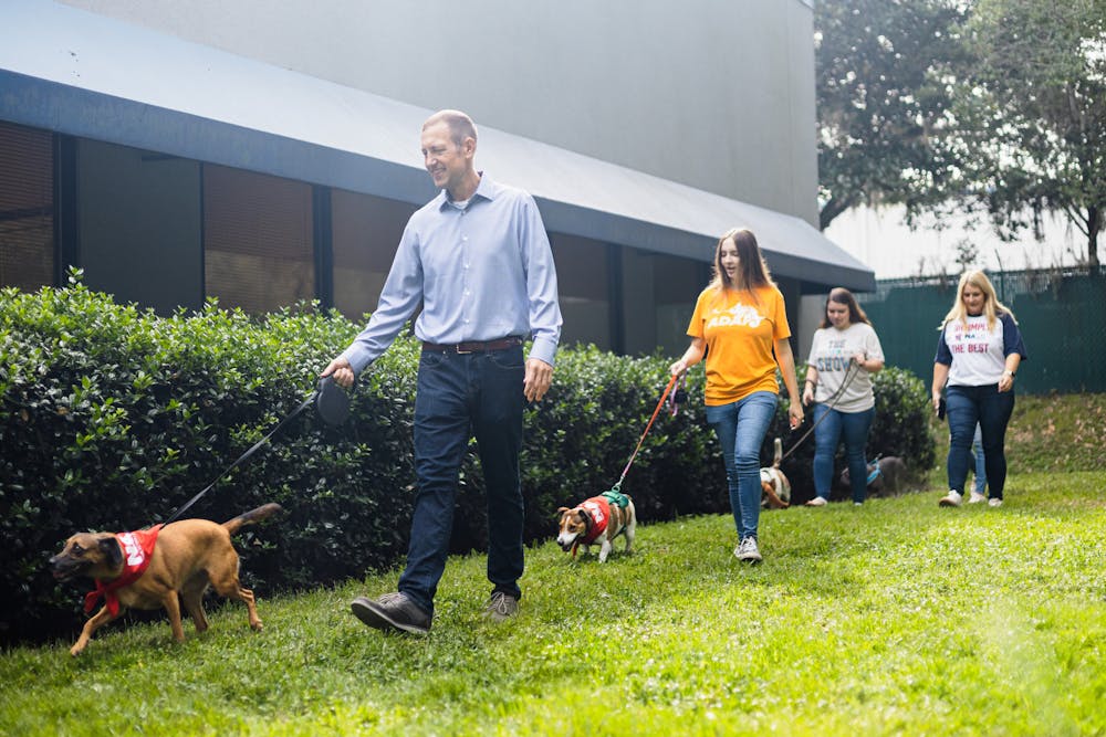 <p>Milley leads owner Dieter Haager on a walk at the NAVC Veterinary Clinic on Sept. 25, 2024.</p>