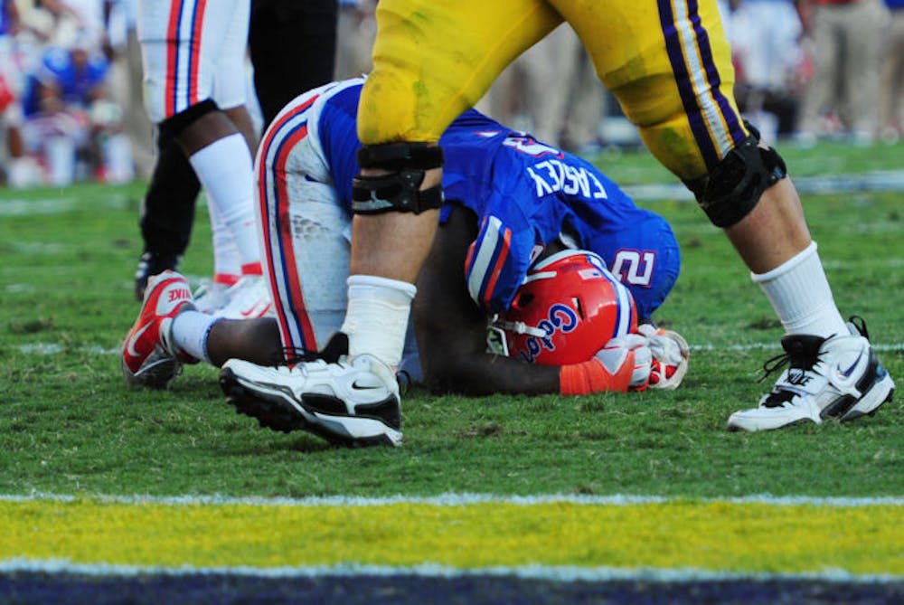 <p>Dominique Easley lies on the ground following a play during Florida’s 41-11 loss against LSU on Oct. 8, 2011 at Tiger Stadium in Baton Rouge, La. The Gators defeated the Tigers at home in 2012.</p>