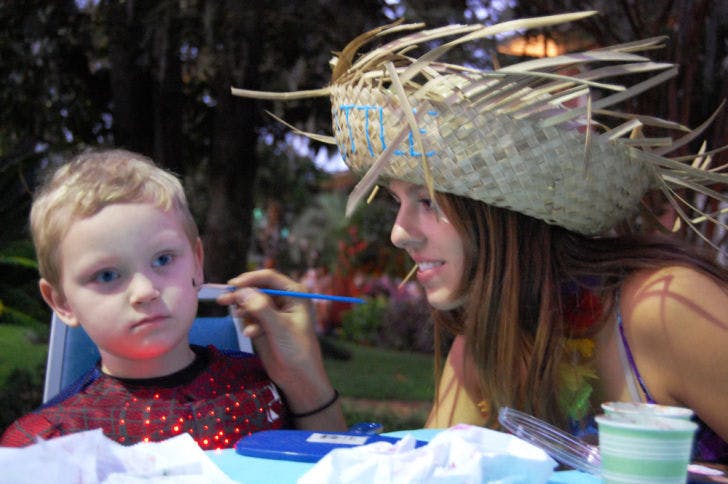 UF nursing freshman Brittany Reeser, 18, paints a spider on 3-year-old Jacob Rowland’s cheek Thursday in front of the Alpha Delta Pi house. The face-painting was a part of Ghouls, Goblins and Greeks held on Sorority Row for children.