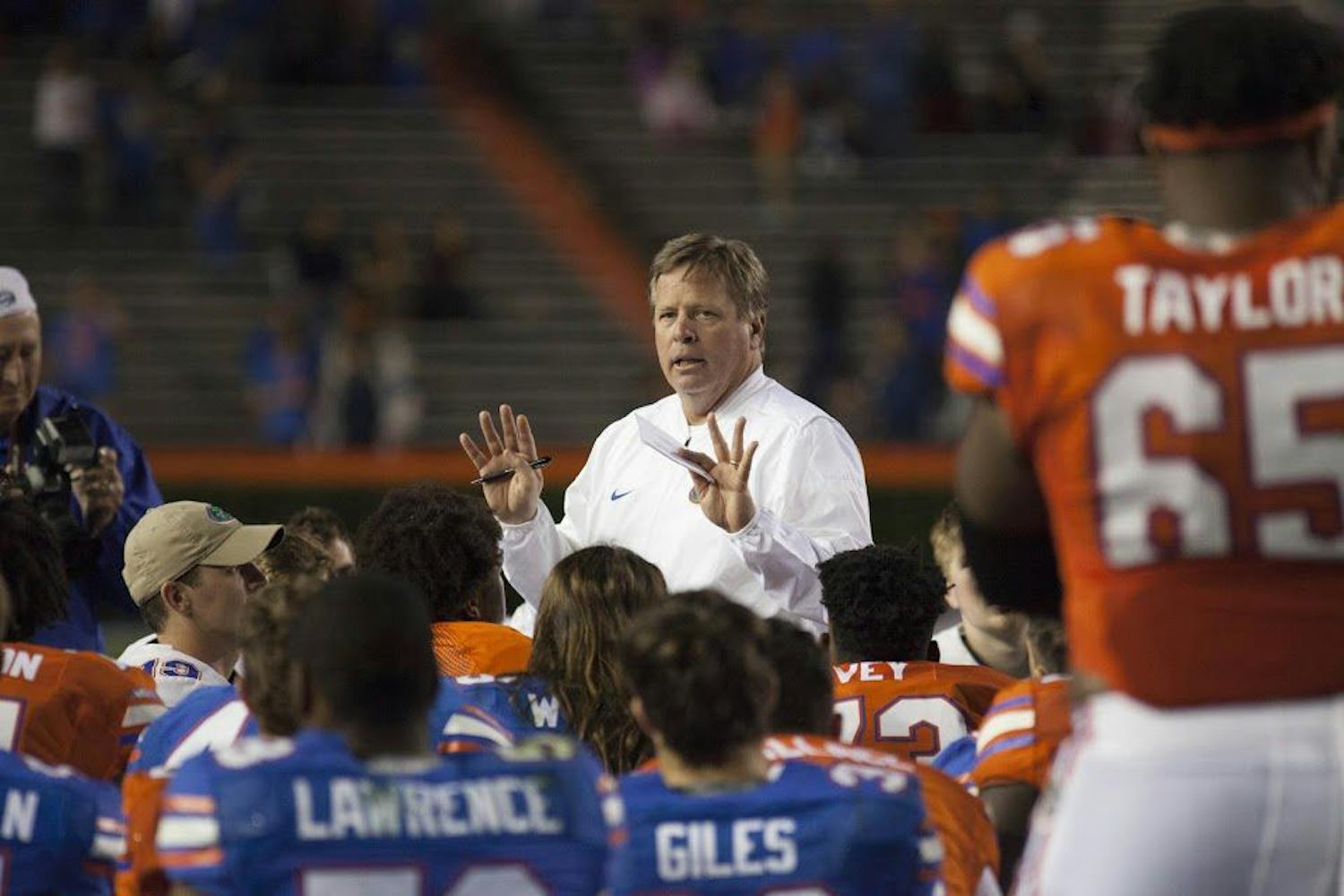 UF head coach Jim McElwain talks to his players after Florida's spring game on April 7, 2017, at Ben Hill Griffin Stadium.
