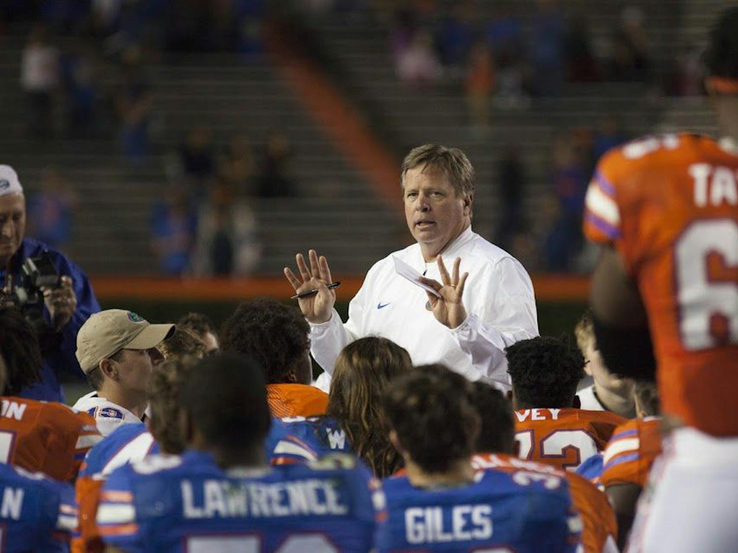 UF head coach Jim McElwain talks to his players after Florida's spring game on April 7, 2017, at Ben Hill Griffin Stadium.