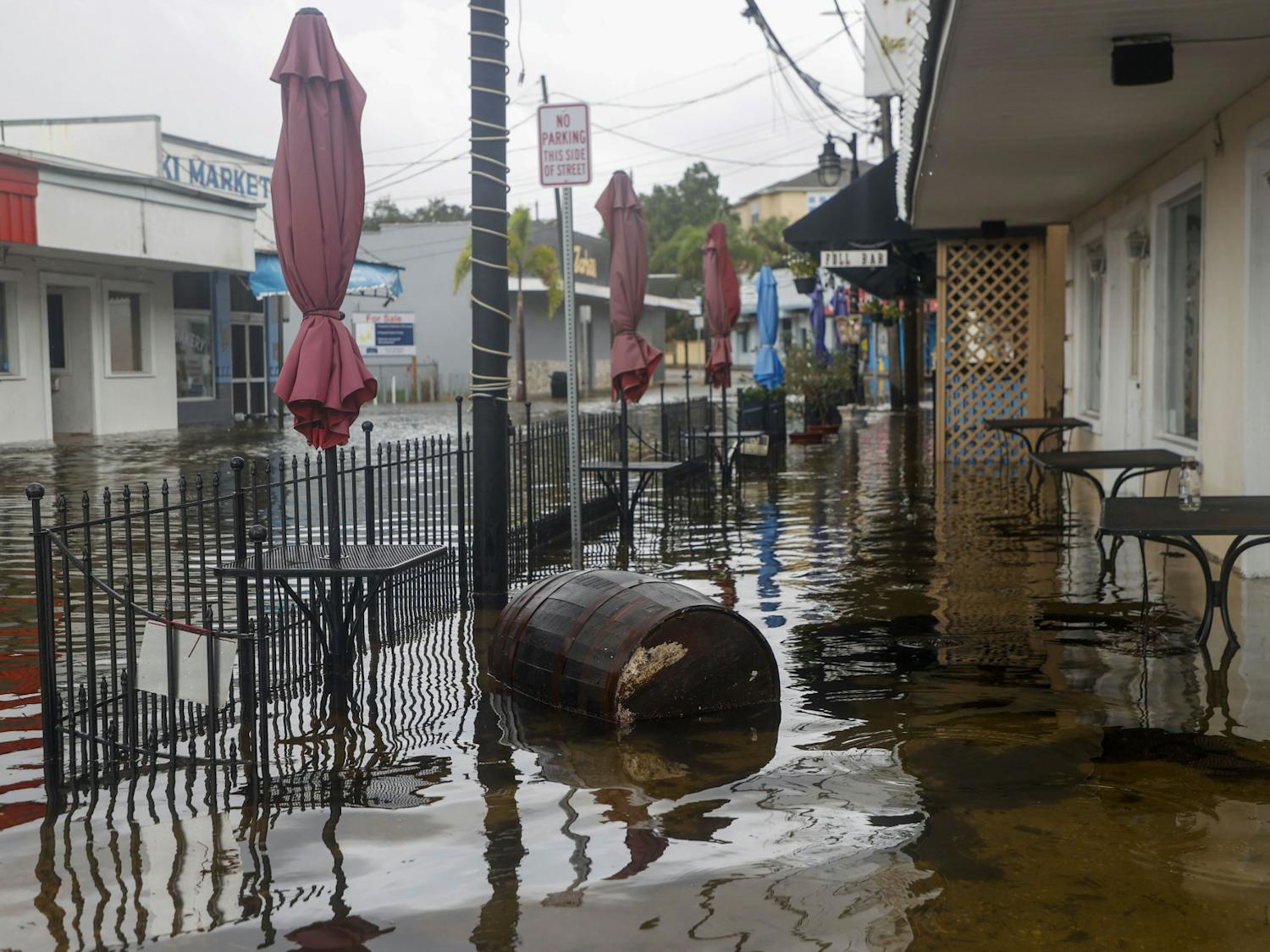 Storm surge from Hurricane Idalia floods Athens Street in Tarpon Springs, Fla., on Wednesday, Aug. 30, 2023. (Ivy Ceballo/Tampa Bay Times via AP)