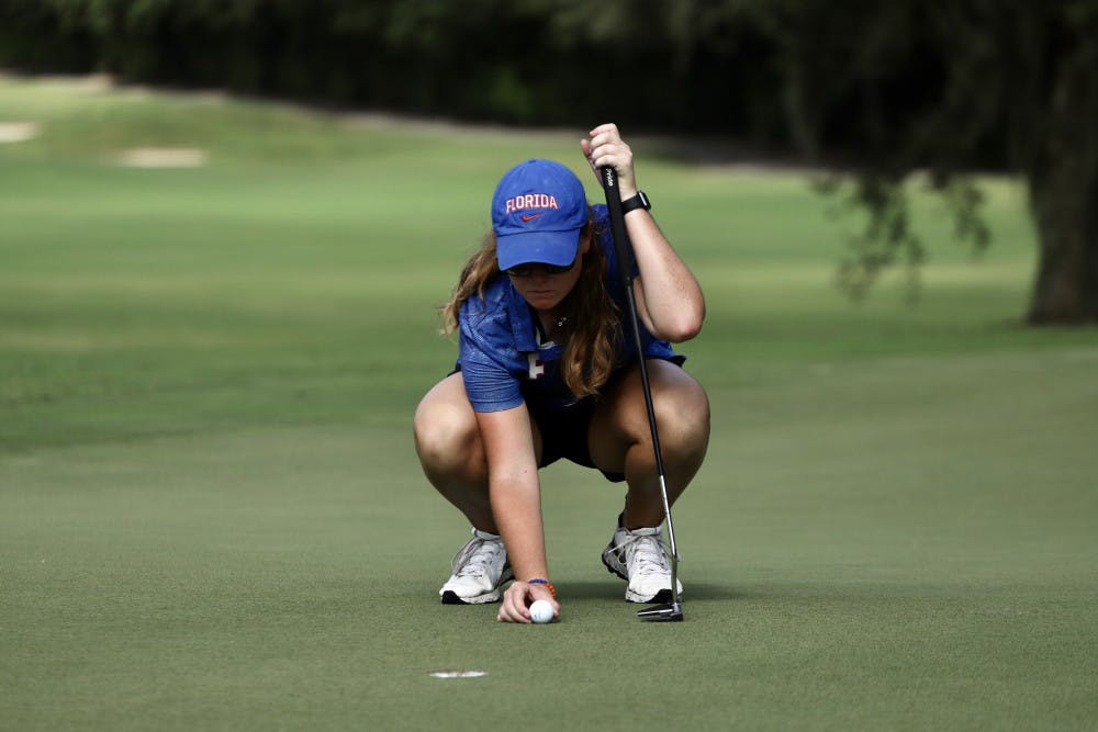 Senior Addie Baggarly practices at Mark Bostick Golf Course. Baggarly and freshman Maisie Filler are currently tied for third overall in the Gators' first tournament of the season.