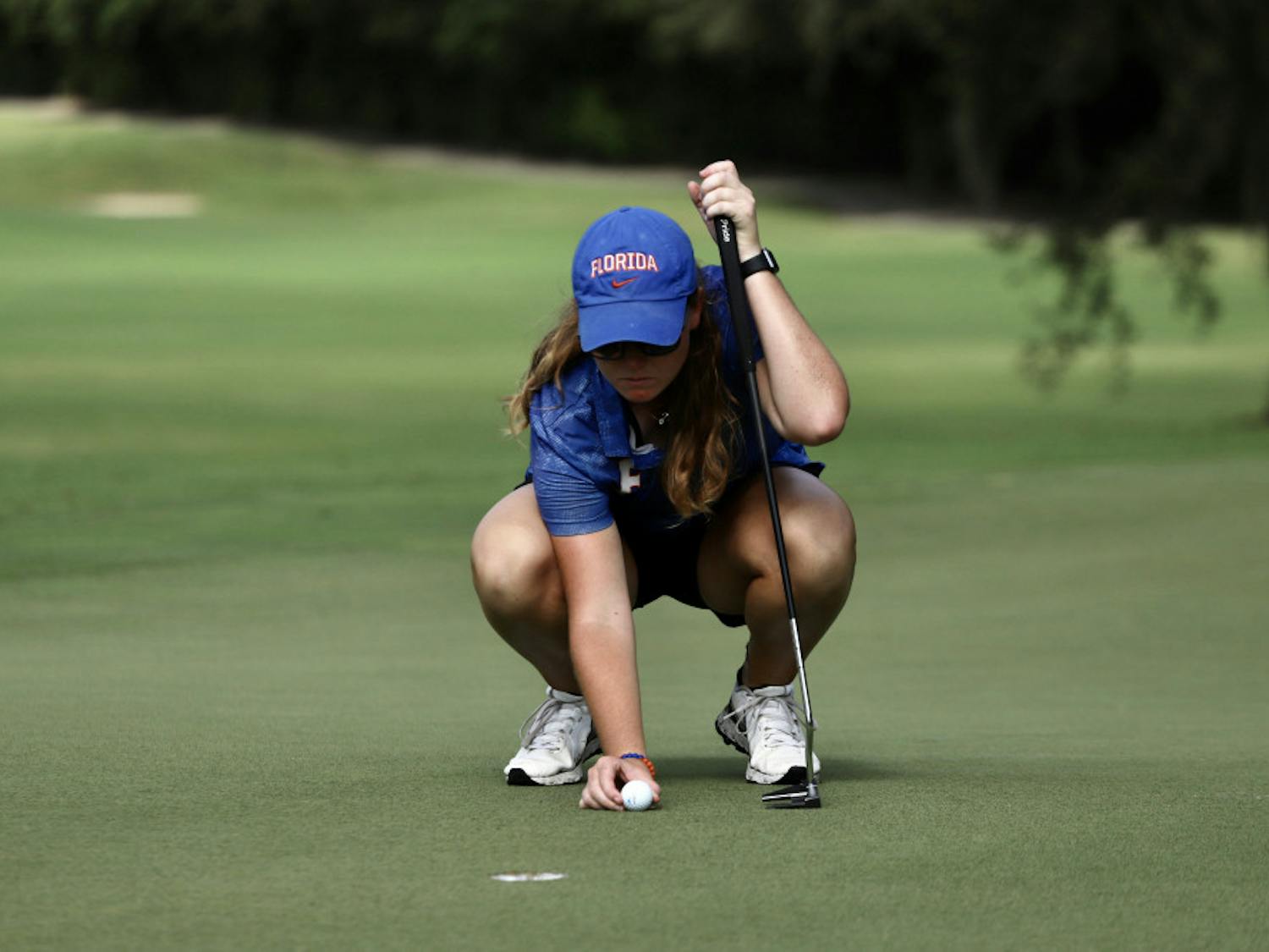Senior Addie Baggarly practices at Mark Bostick Golf Course. Baggarly and freshman Maisie Filler are currently tied for third overall in the Gators' first tournament of the season.