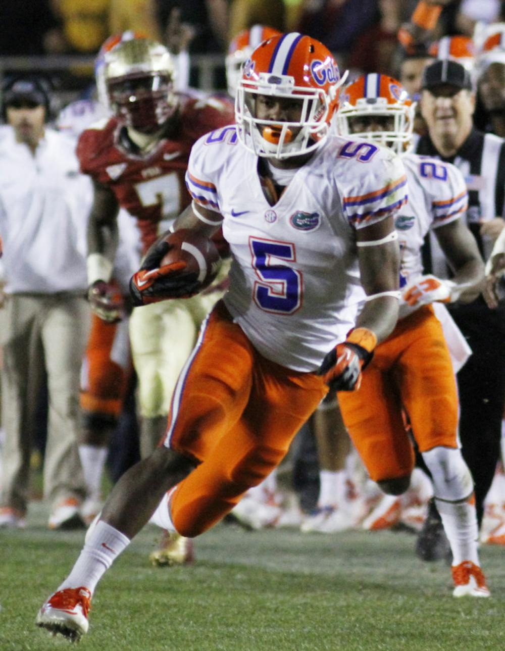 <p>Marcus Roberson (5) takes the ball down the field during Florida's 37-26 win against Florida State at Doak Cambell Field in Tallahassee, Fla., on Nov. 24.</p>