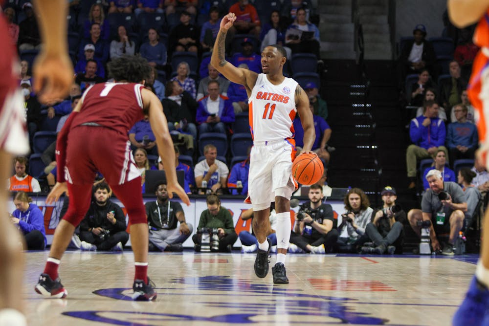 Florida guard Kyle Lofton directs the offense in the Gators 81-60 victory against the South Carolina Gamecocks Wednesday, Jan. 25, 2023.