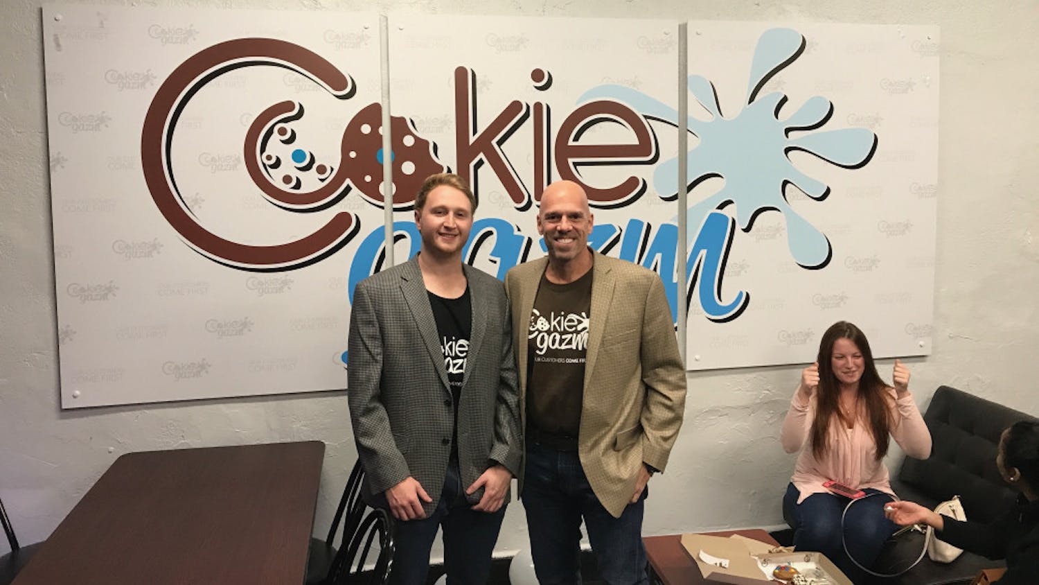 Aaron Seemann, owner, and Jose Benacerraf, partner and investor, celebrate the opening of Cookiegazm’s new store located in downtown Gainesville.