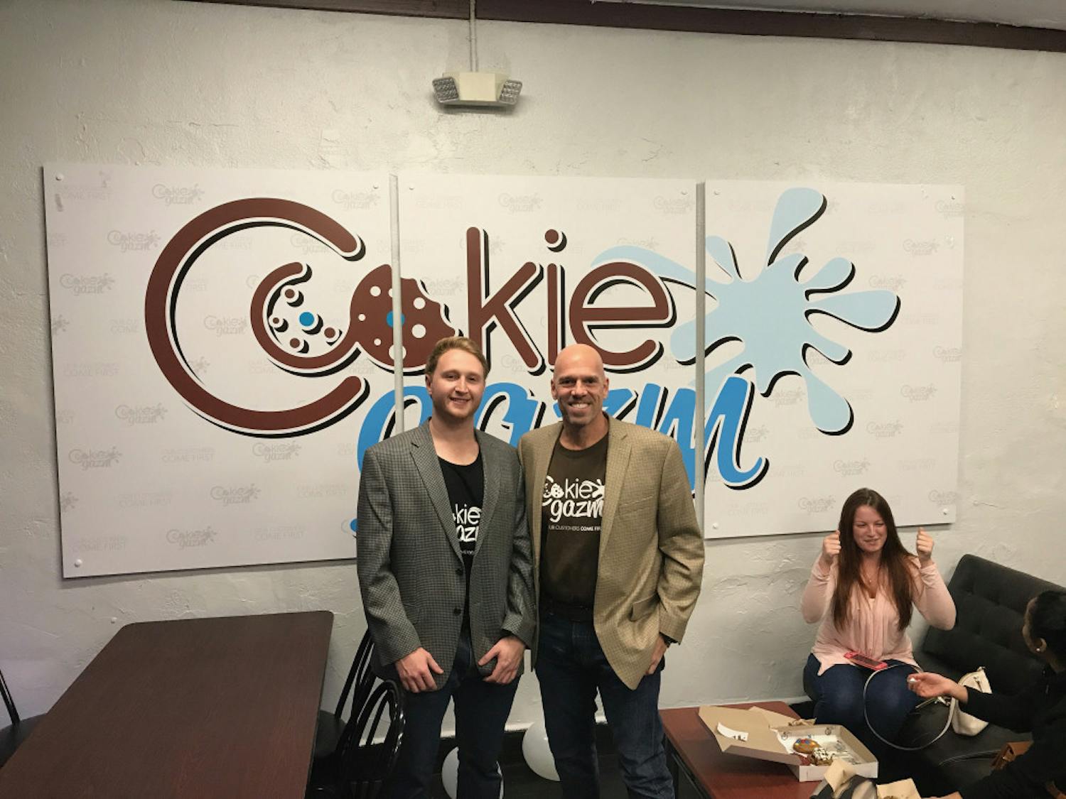 Aaron Seemann, owner, and Jose Benacerraf, partner and investor, celebrate the opening of Cookiegazm’s new store located in downtown Gainesville.