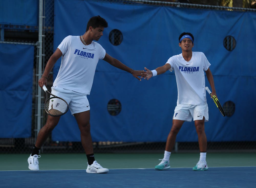 Florida tennis freshmen Tanapatt Nirundorn and Togan Tokac share the court at the Gator Fall Invite Sunday, Nov. 6, 2022. (Photo by Sydney Calle)