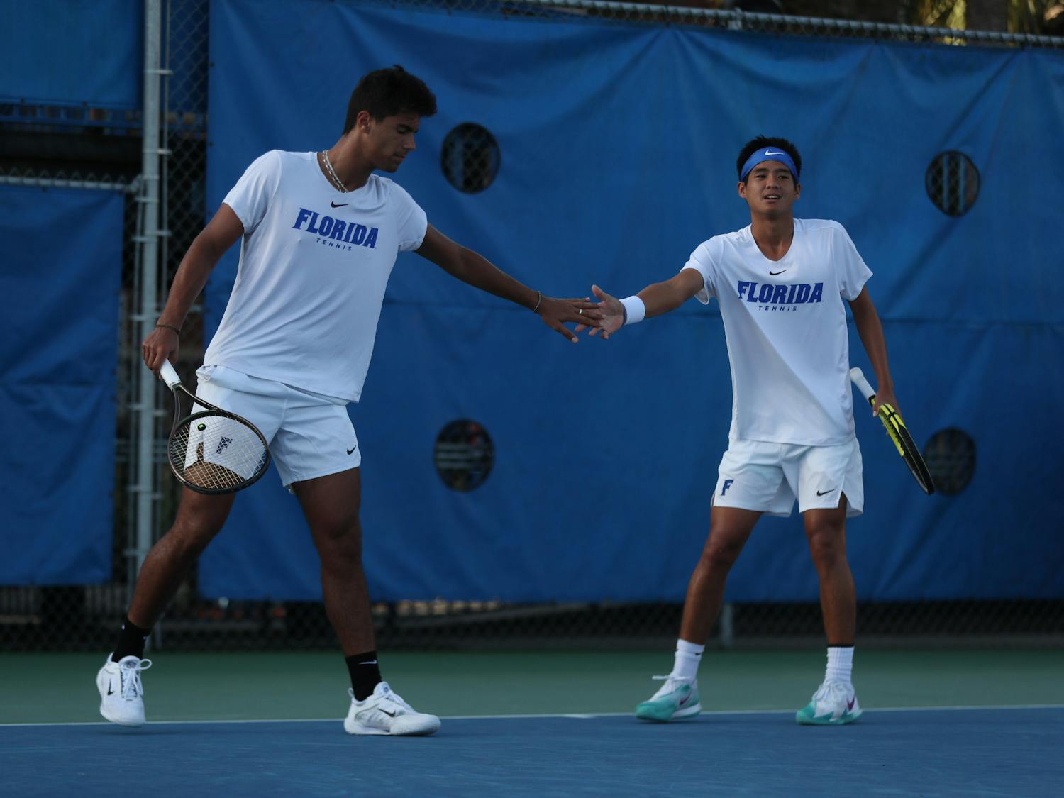 Florida tennis freshmen Tanapatt Nirundorn and Togan Tokac share the court at the Gator Fall Invite Sunday, Nov. 6, 2022. (Photo by Sydney Calle)