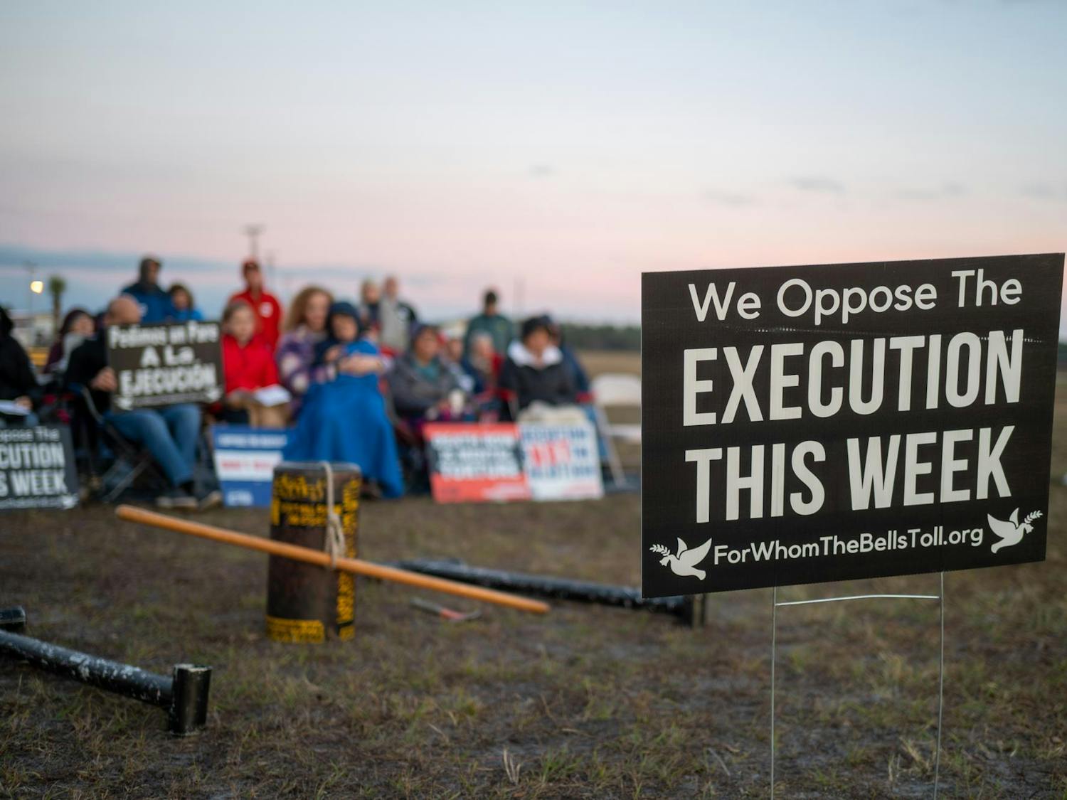 Protestors of the death penalty sit outside Florida State Prison and pray in opposition to the execution of Mark Allen Geralds. Geralds was executed in Raiford on Tuesday, Dec. 9, 2025.