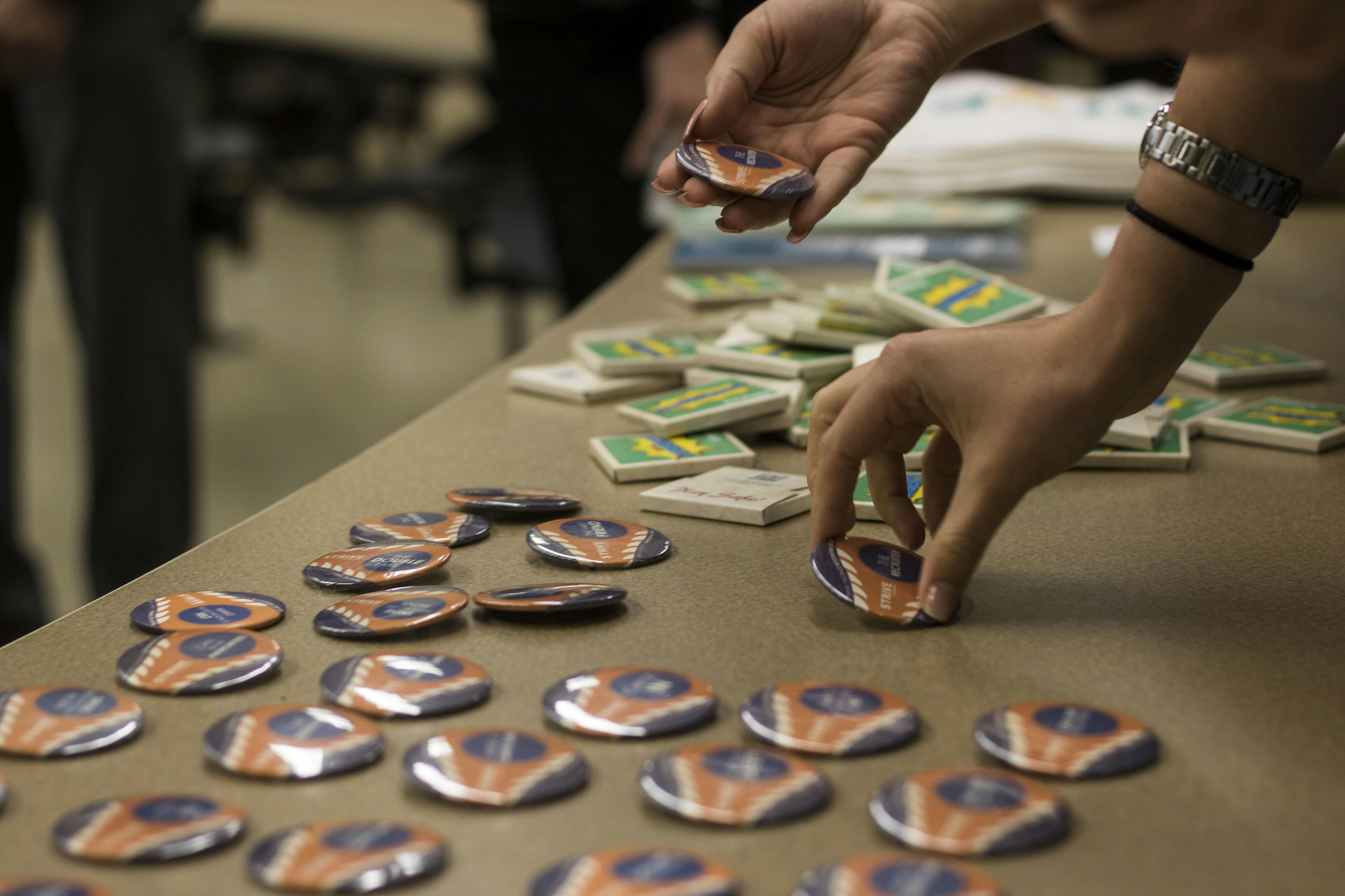 Audience members were offered free condoms, buttons and pizza Thursday during the No Es No: Dissecting Rape Culture on Campus event in Turlington Hall. About 75 students attended the event, which was presented by Sigma Lambda Beta International Fraternity and Sexual Trauma Interpersonal Violence Education by GatorWell.