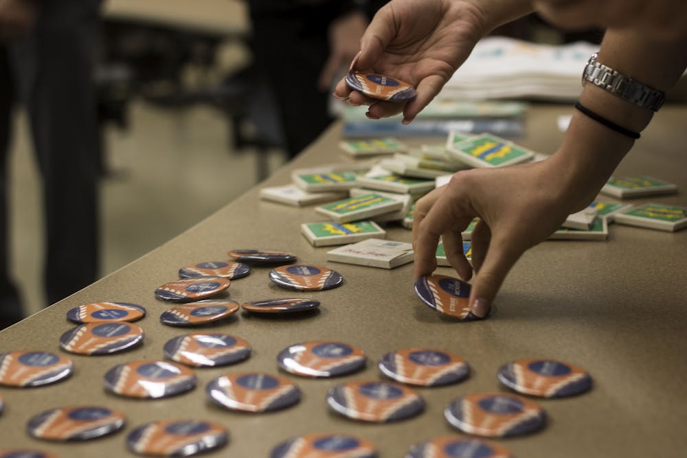 <p>Audience members were offered free condoms, buttons and pizza Thursday during the No Es No: Dissecting Rape Culture on Campus event in Turlington Hall. About 75 students attended the event, which was presented by Sigma Lambda Beta International Fraternity and Sexual Trauma Interpersonal Violence Education by GatorWell.</p>