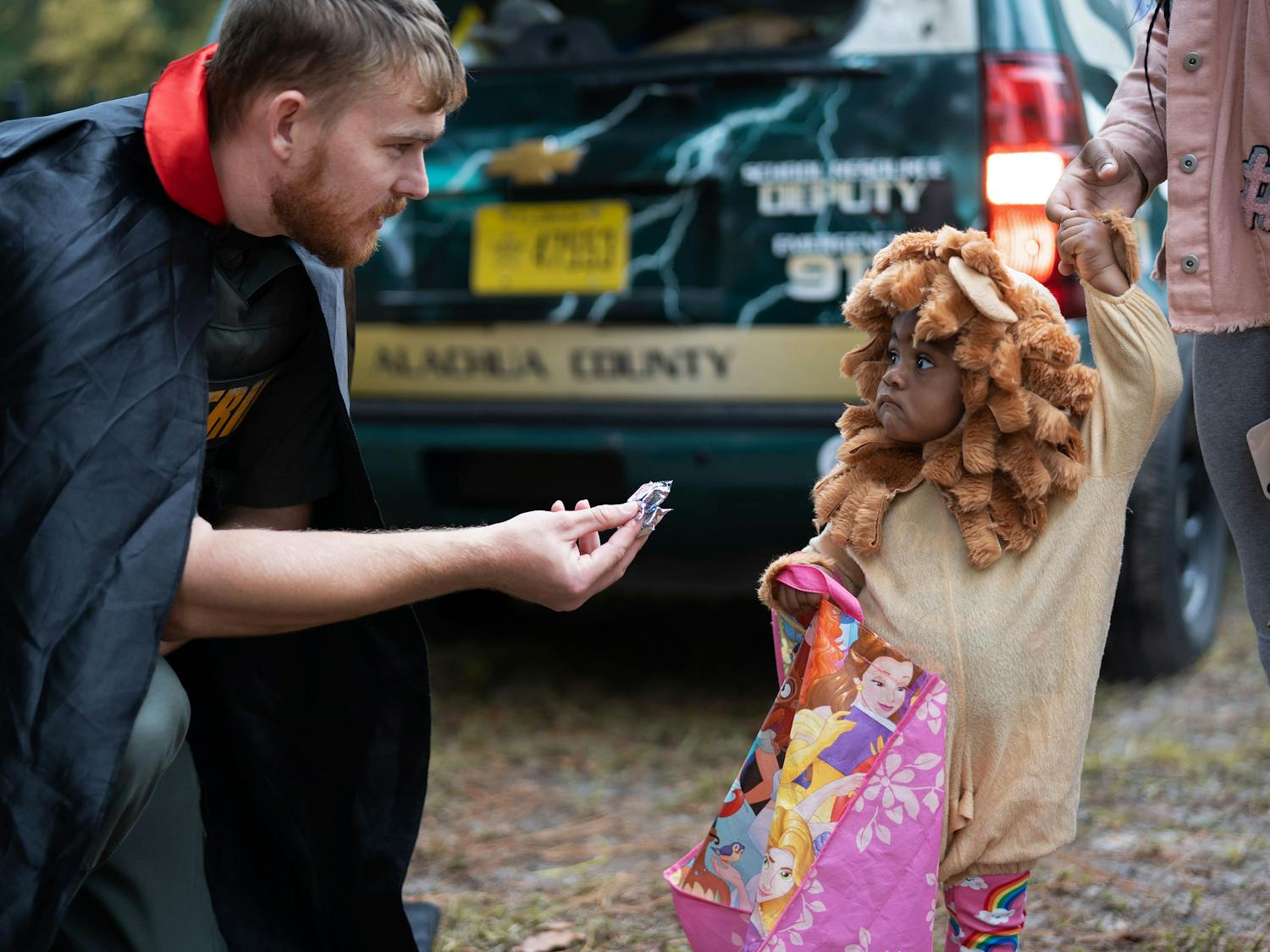 Halloween came early for kids who attended the second annual First Responders Trunk or Treat event Friday night. The event, presented by the Youth and Community Resource Unit of the Alachua County Sheriff’s Office, was held in the grassy lot near the station. People received free food and candy, played games and won prizes. This year, about 300 people attended.