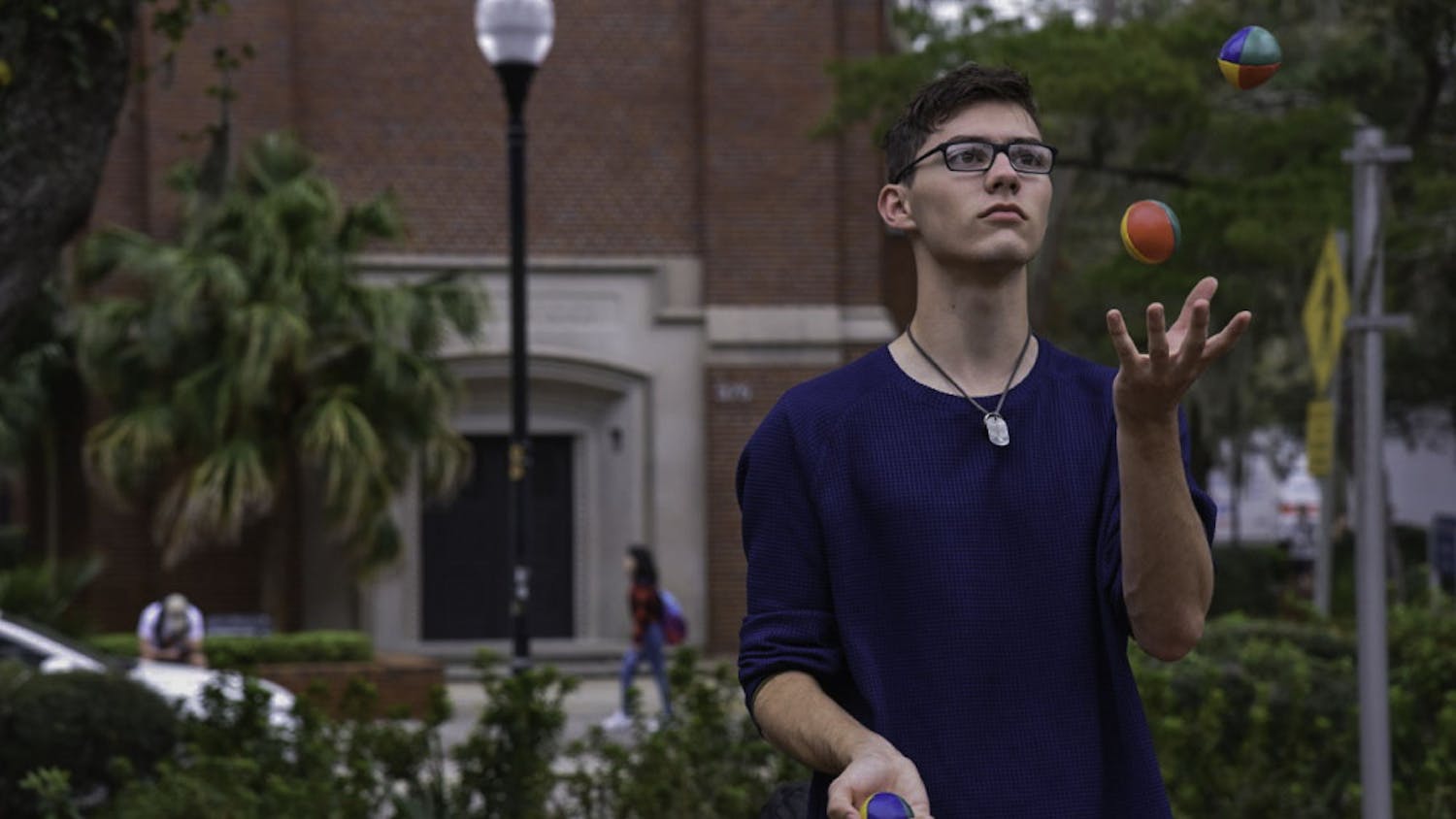 Ethan Irvin, a 19-year-old UF mathematics sophomore, juggles on Turlington Plaza on Feb. 12. Irvin said he's been juggling for more than two years and loves doing it. "It's a good stress reliever,” he said.