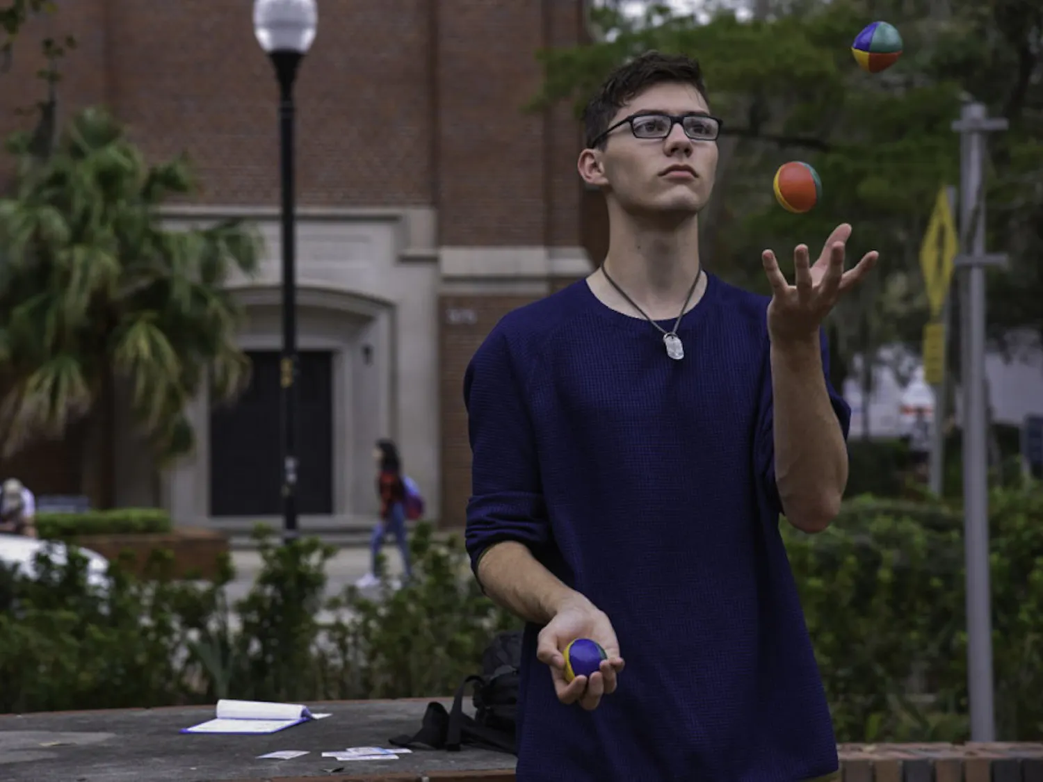 Ethan Irvin, a 19-year-old UF mathematics sophomore, juggles on Turlington Plaza on Feb. 12. Irvin said he's been juggling for more than two years and loves doing it. "It's a good stress reliever,” he said.