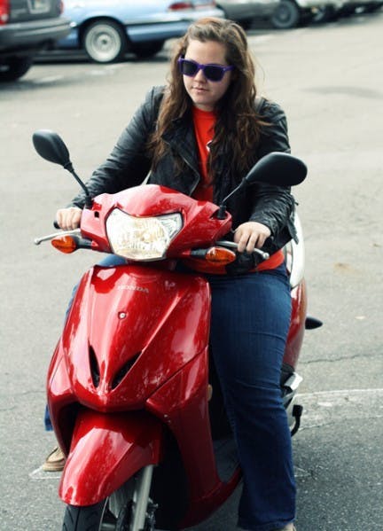 Advertising major Kelsey Stalnaker rides her scooter to and from her home and Weimer Hall.