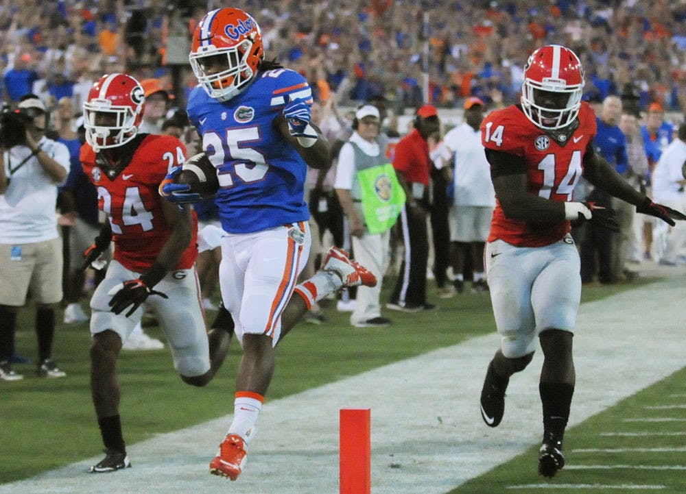 <p>UF running back Jordan Scarlett (25) runs out of bounds after a 60-yard gain in the fourth quarter of Florida's 27-3 win against Georgia on Oct. 31, 2015, at EverBank Field in Jacksonville.</p>