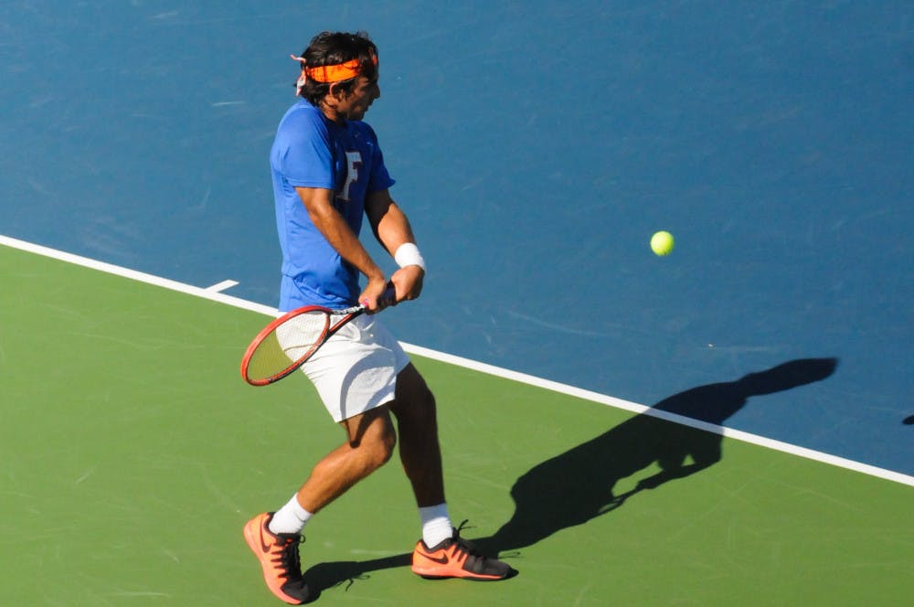 <p>Diego Hidalgo returns a ball during Florida's 6-1 win over Troy on Jan. 17, 2016, at the Ring Tennis Complex.</p>
