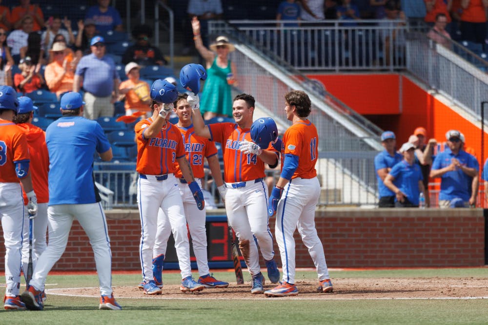 Florida catcher Karson Bowen (14) celebrates hitting a home run during an NCAA baseball game against High Point University, Sunday, March 8, 2026, in Gainesville, Fla.