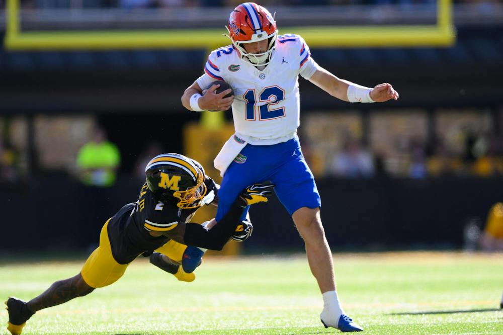Florida quarterback Aaron Philo (12) rushes during the first half of an NCAA college football game against Missouri, Saturday, Oct. 3, 2026, in Columbia, Mo.