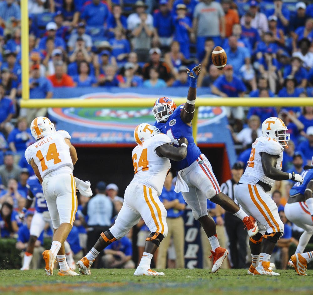 <p>Defensive lineman Damien Jacobs bats down a pass from UT quarterback Justin Worley during Florida's 31-17 win against Tennessee on Saturday in Ben Hill Griffin Stadium.</p>