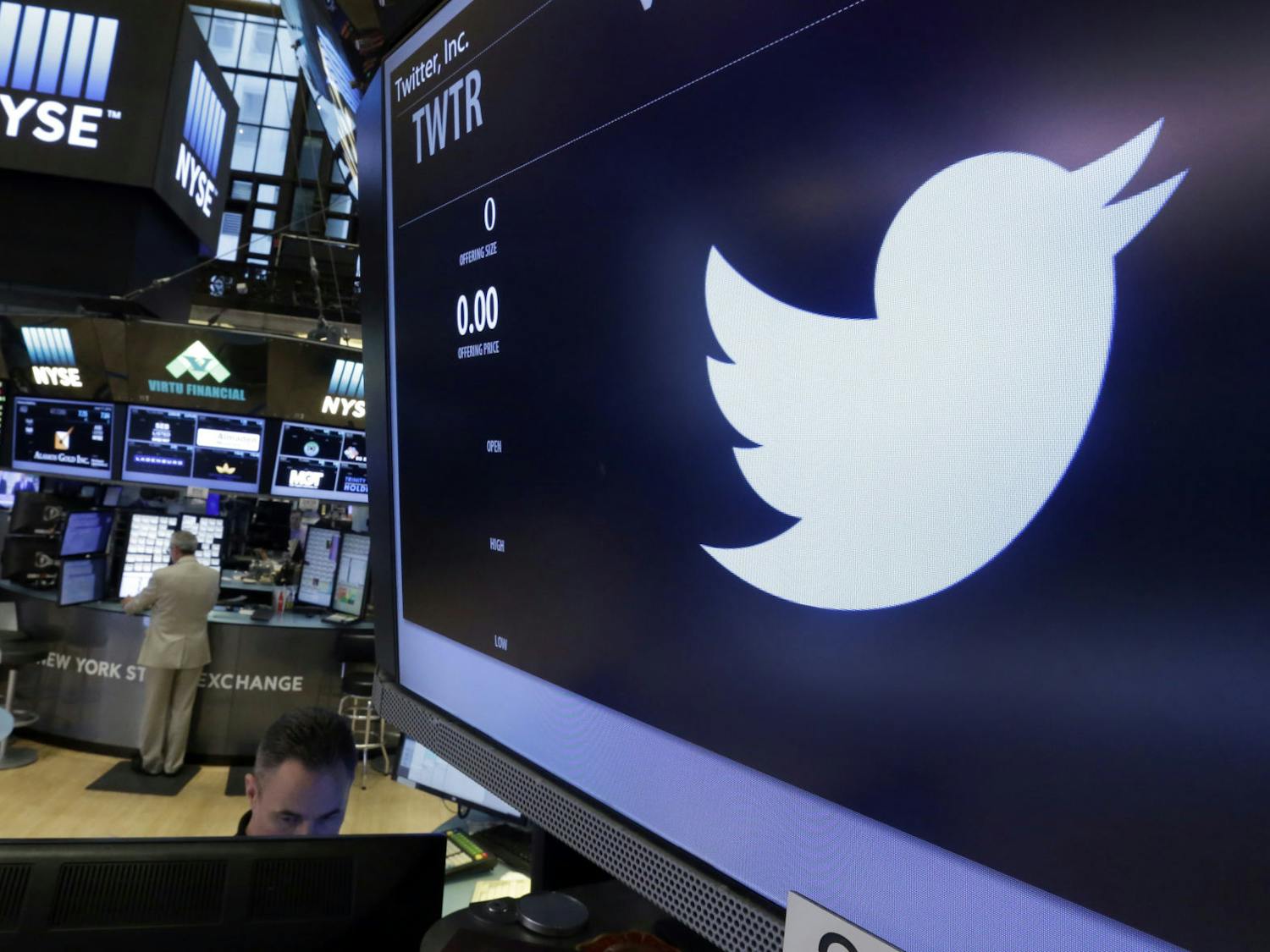 The Twitter logo appears at the post where it trades, on the floor of the New York Stock Exchange, Friday, June 17, 2016. (AP Photo/Richard Drew)