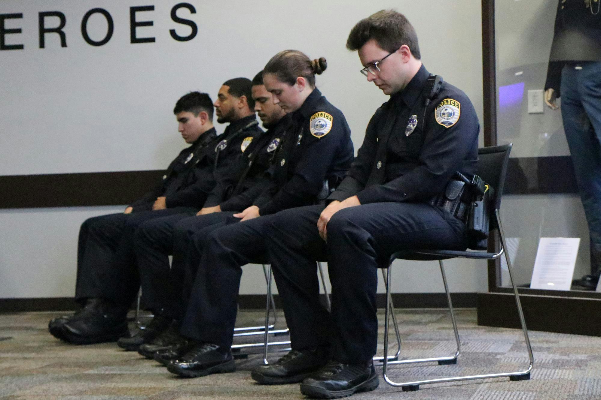 Officers Andrew Barajas #1296, Christian Crespo #1278, Darian Diaz #1286, Sydney Harper #1295 and Elwood Leonard #1293 sit during the swearing in ceremony at the Gainesville Police Department in Gainesville, Fla. on June 5, 2026. (Photo by Riana Sage)