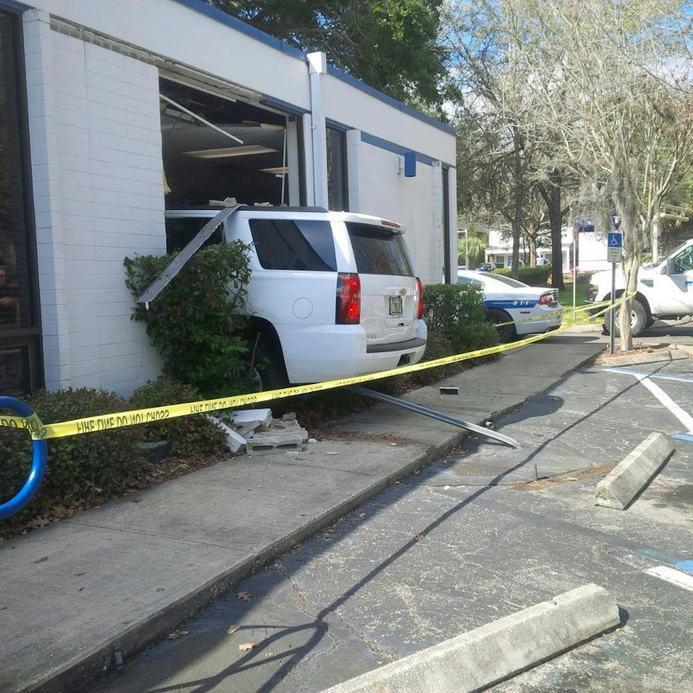 <p>A women in her mid-60s crashed her white Chevrolet Tahoe (pictured above) into the Campus USA Credit Union on Southwest Fifth Avenue Friday afternoon.</p>
