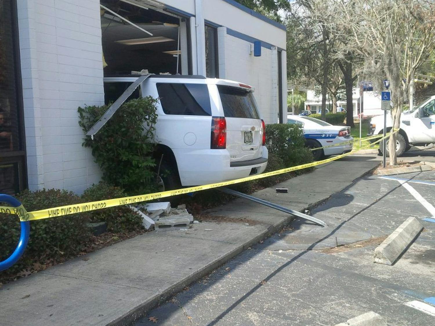 A women in her mid-60s crashed her white Chevrolet Tahoe (pictured above) into the Campus USA Credit Union on Southwest Fifth Avenue Friday afternoon.