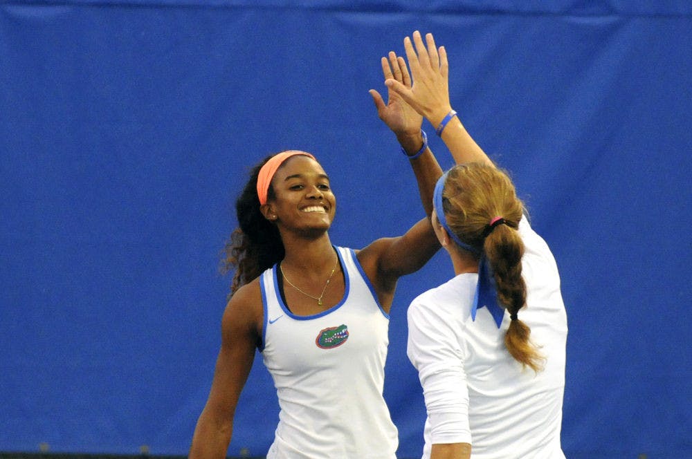 UF doubles tandem Brianna Morgan and Anna Danilina celebrate during Florida’s win over USF on Jan. 27, 2016, at the Ring Tennis Complex.