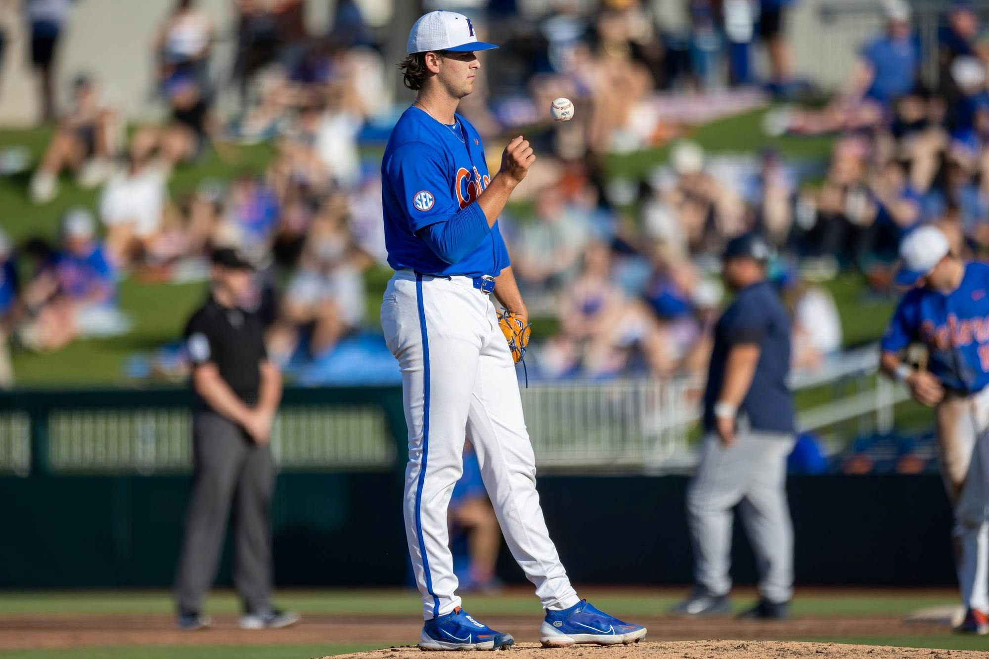 Florida right-handed pitcher Liam Peterson (12) tosses the ball during an NCAA college baseball game against Auburn at Condron Family Ballpark in Gainesville, Fla., Friday, April 17, 2026.