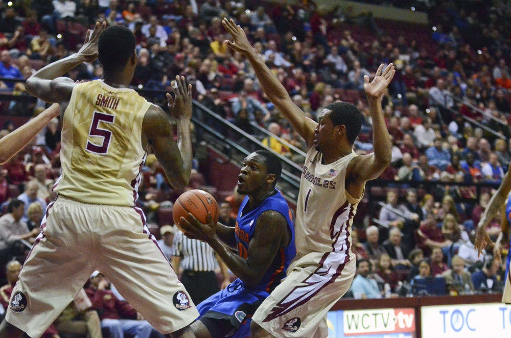 <p>Michael Frazier II drives into the paint during Florida's 65-63 loss to Florida State on Dec. 30 in Tallahasee.</p>