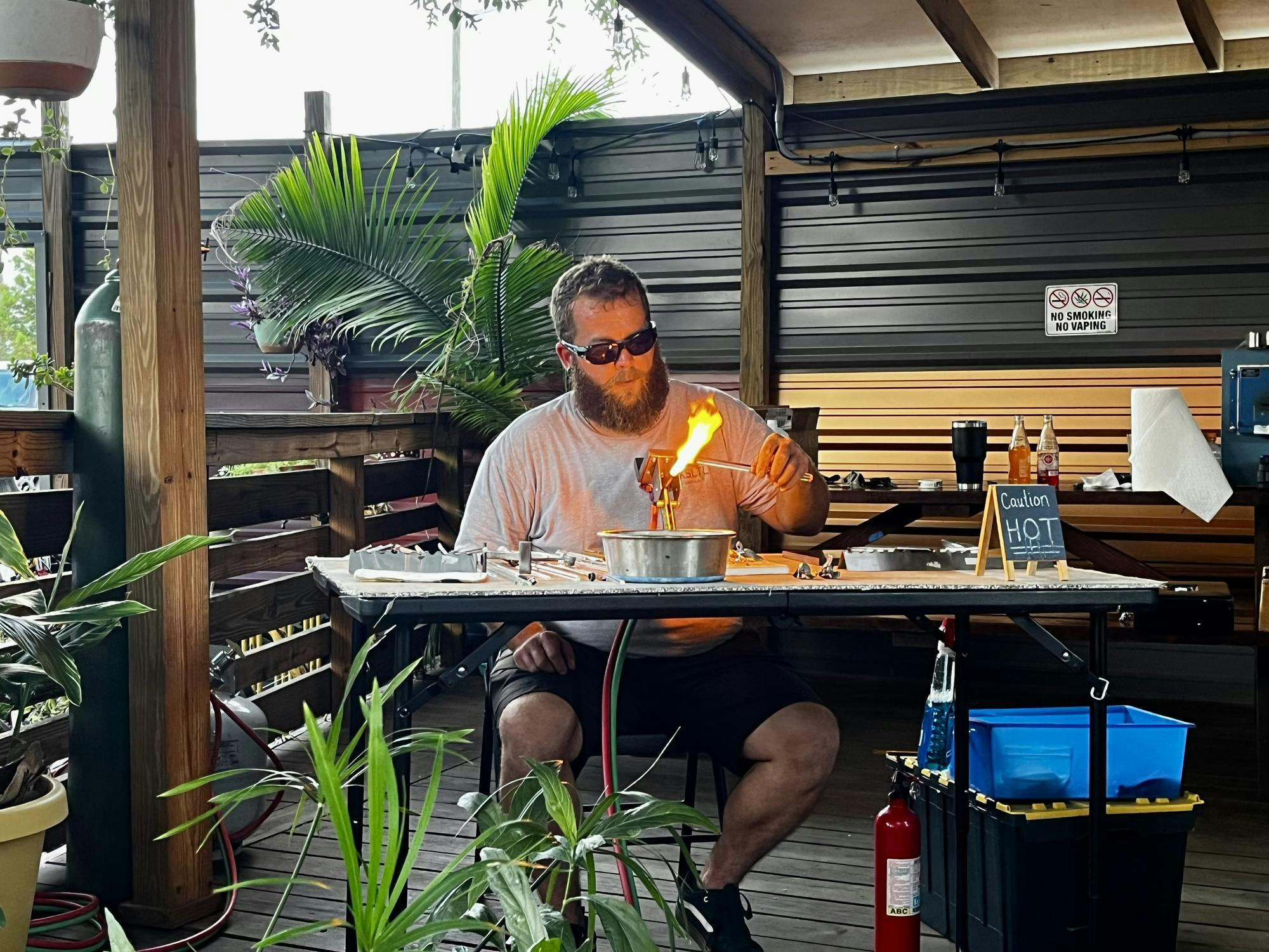 Ryan Malone, owner of RM Glass, glass blows at Swamp Boogie III at First Magnitude Brewing Co. in Gainesville, Fla., on July 18, 2026. 