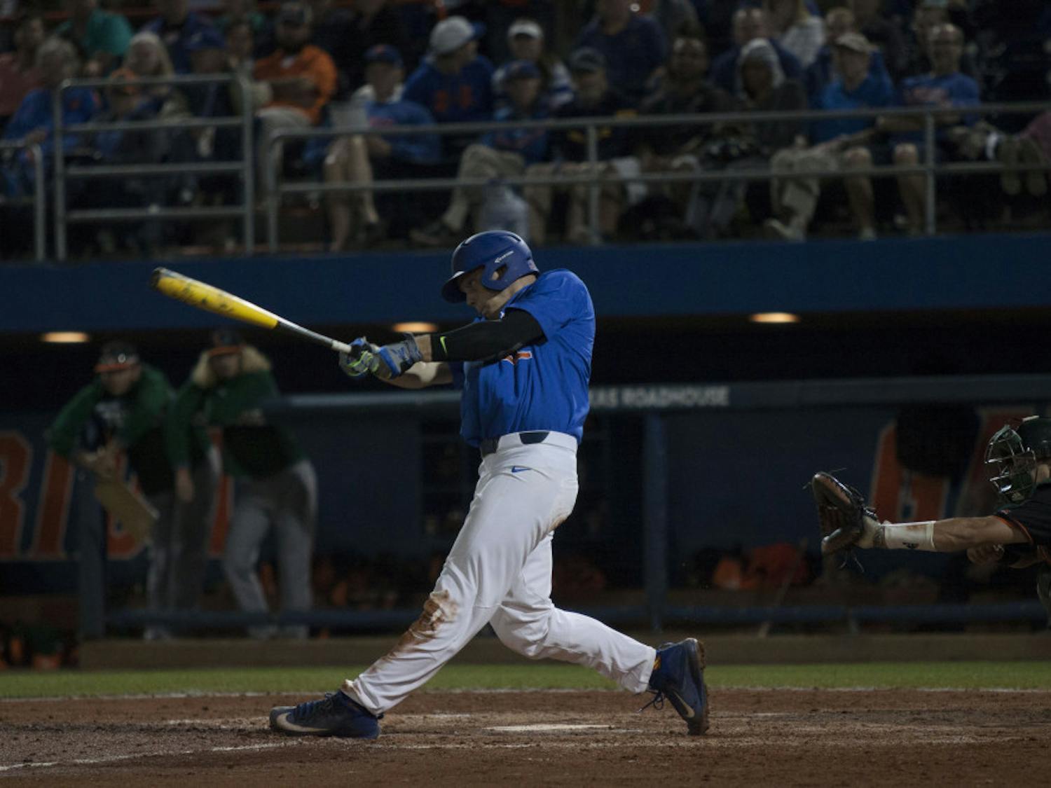 JJ Schwarz swings during Florida's 2-0 win against Miami on Feb. 25, 2017, at McKethan Stadium.
