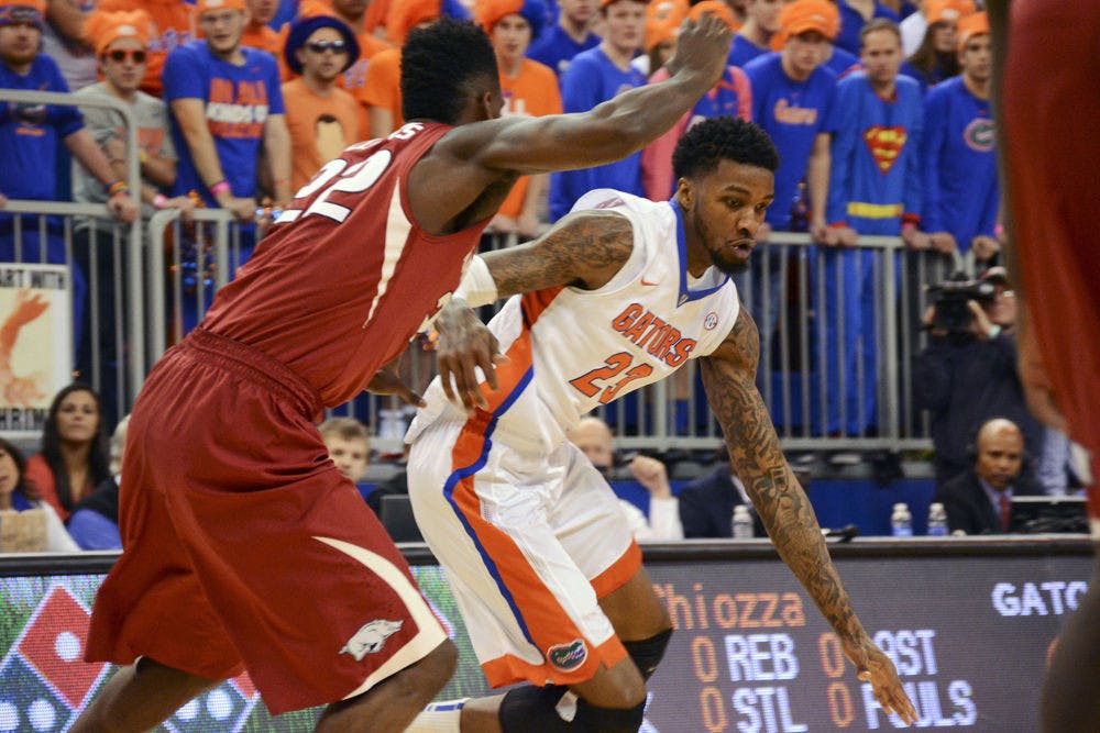 <p>Chris Walker dribbles during Florida's 57-56 win against Arkansas on Saturday in the O'Connell Center.</p>