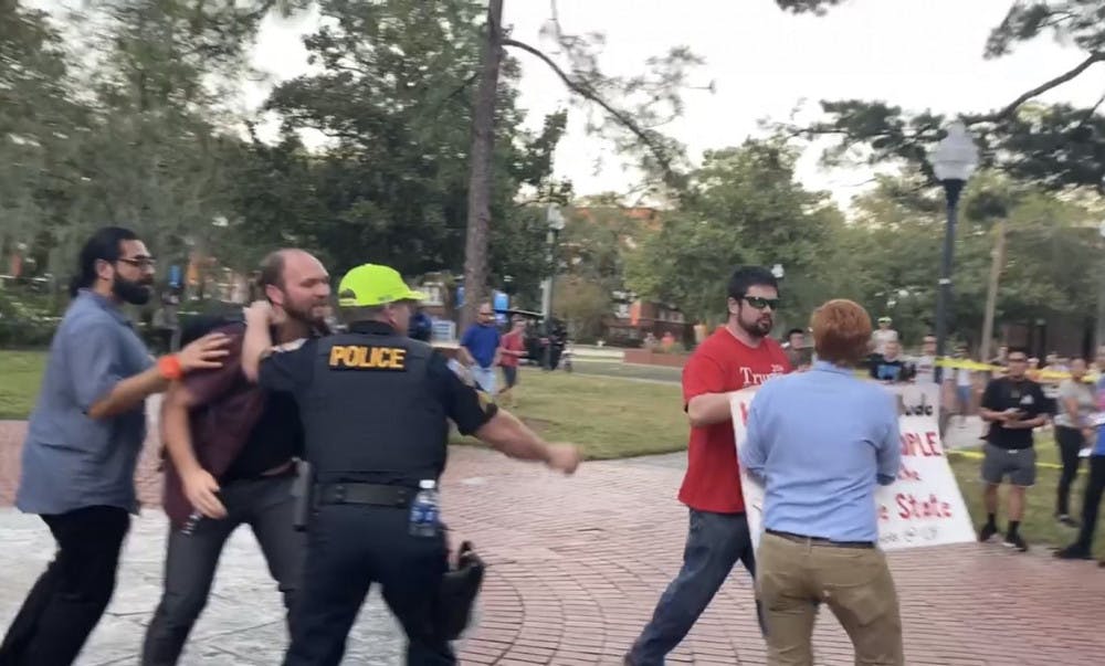 Brian Patrick Smith was outside University Auditorium Thursday night among among protestors who were protesting against Donald Trump Jr. and Kimberly Guilfoyle's speech. Richard Tate was arrested after taking Smith's "Make America Great Again" cap.
&nbsp;
